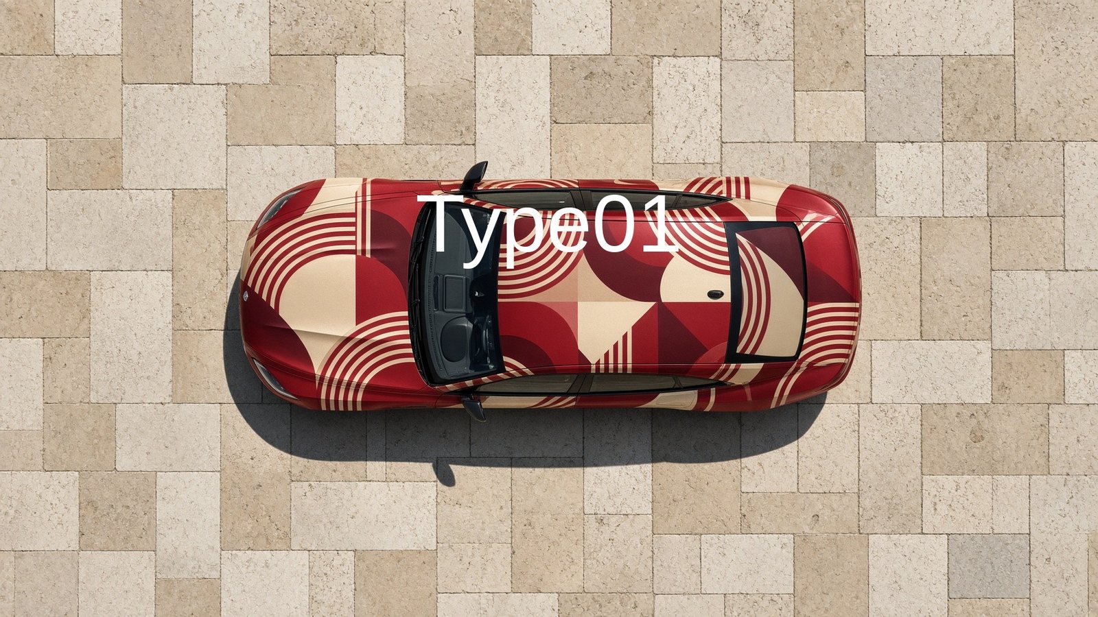 Jaguar Type 01 four-door GT, aerial view in geometric wrap